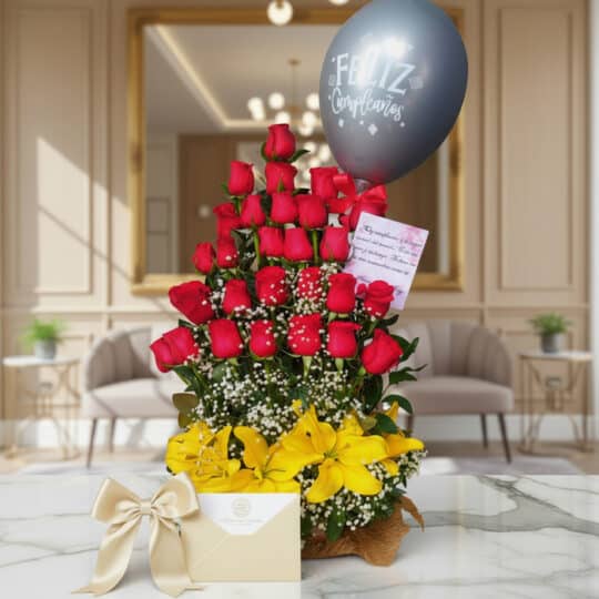 Arreglo floral exótico Gamma con rosas rojas, lirios amarillos y follaje verde, presentado en un entorno elegante y lujoso.